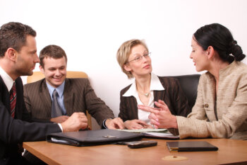 Business meeting - two women, 2 men